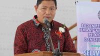 Penjabat Bupati Minahasa Pnt. Dr. Jemmy Stani Kumendong, MSi saat membawakan sambutan (ist)