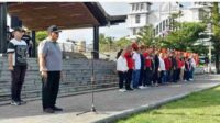 Bupati Robby Dondokambey, bersama Wakil Bupati Vanda Sarundajang dan Ketua TP PKK Minahasa, Martina Dondokambey-Lengkong saat memimpin apel (ist)